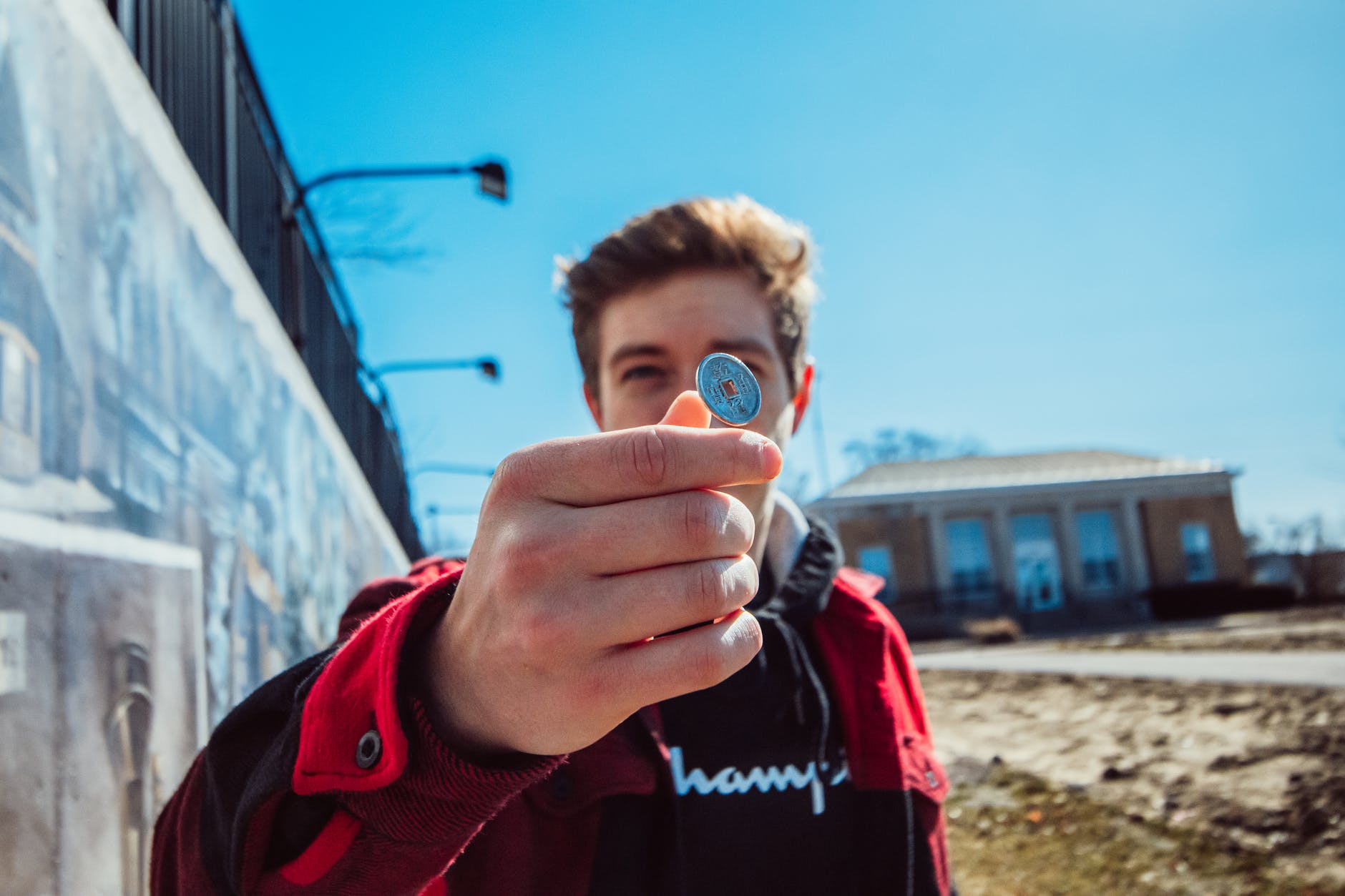 man tossing a coin